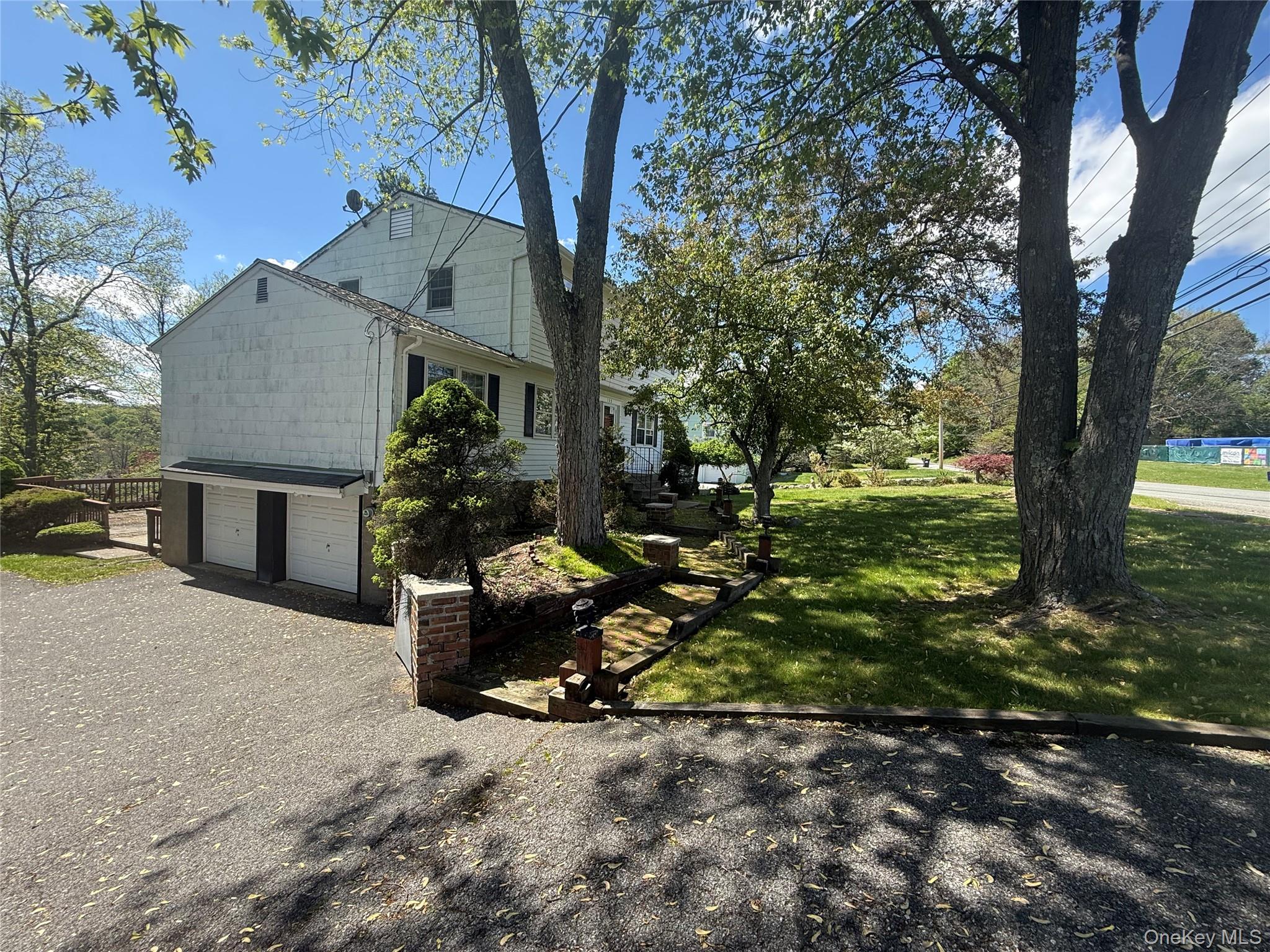 155 Pine Tree Road Monroe, NY 10950 - Photo 3 of 49 a backyard of a house with table and chairs