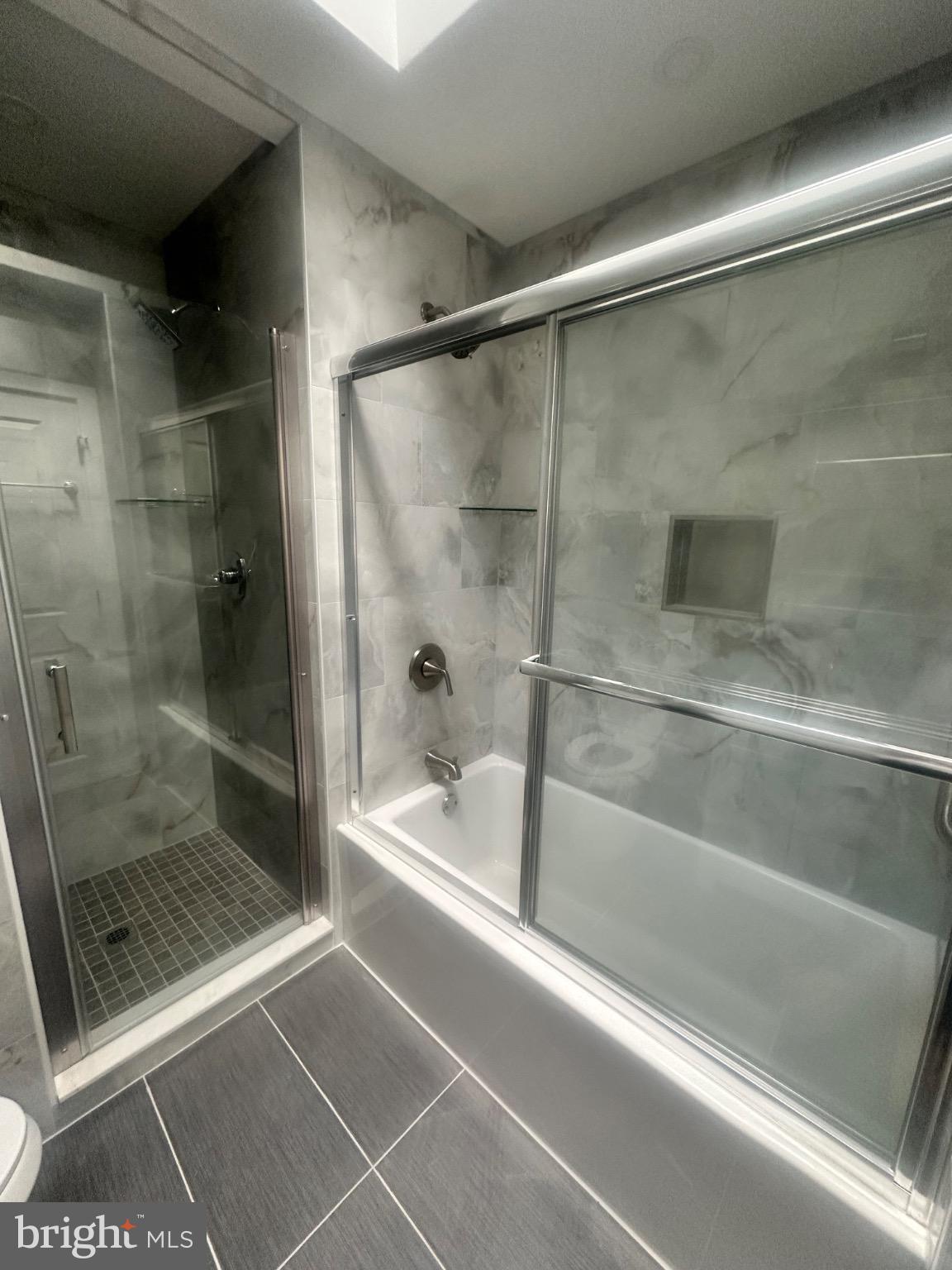 2146 East Washington Lane Philadelphia, PA 19138 - Photo 23 of 32 a bathroom with a bath tub and shower