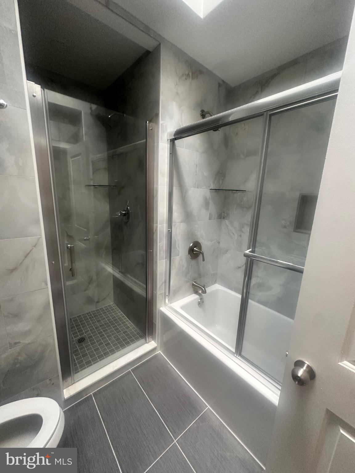 2146 East Washington Lane Philadelphia, PA 19138 - Photo 24 of 32 a bathroom with a shower and a toilet