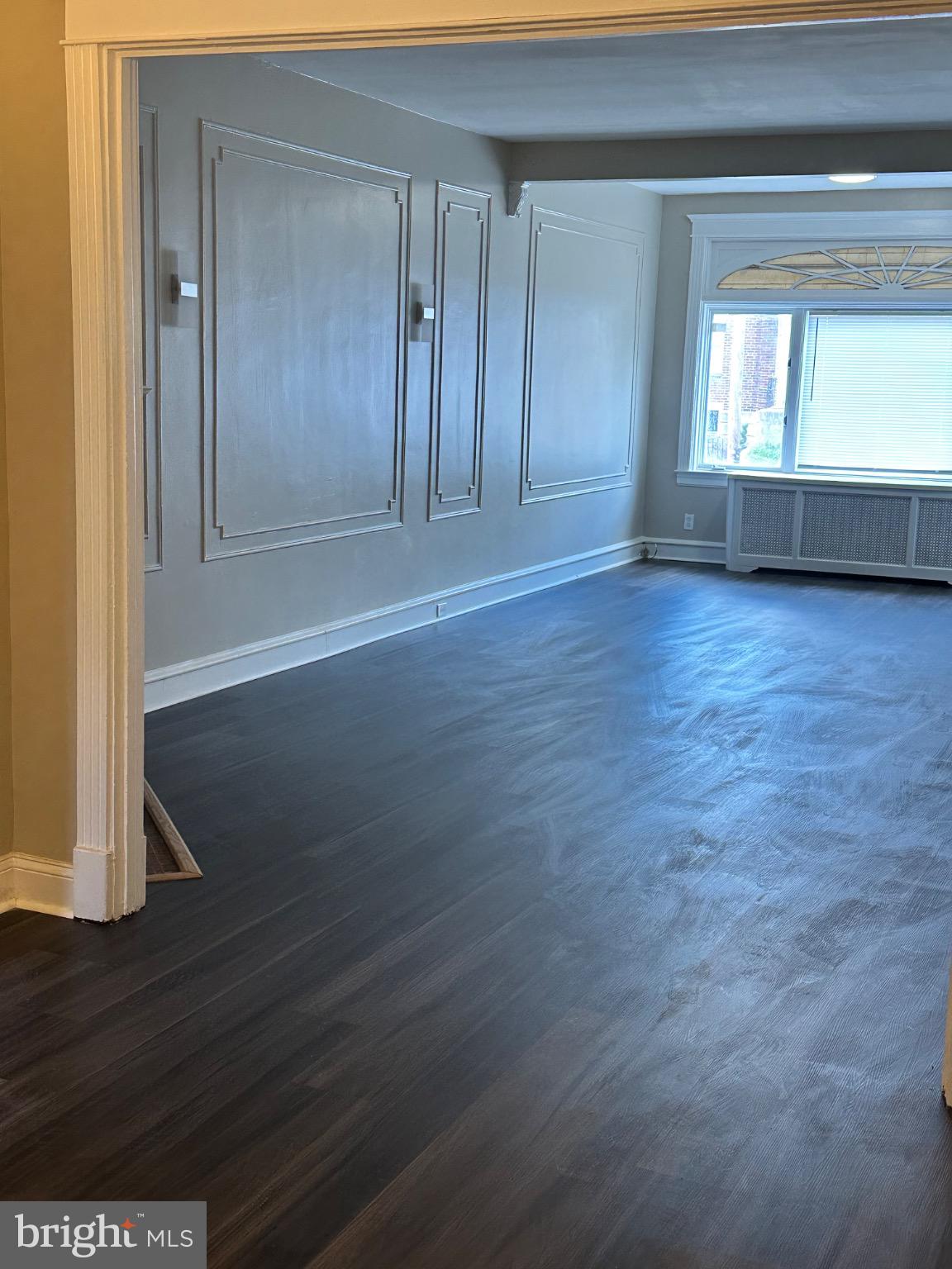 2146 East Washington Lane Philadelphia, PA 19138 - Photo 28 of 32 an empty room with wooden floor and windows