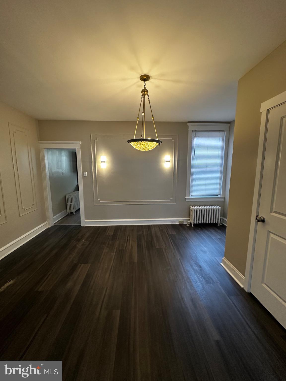 2146 East Washington Lane Philadelphia, PA 19138 - Photo 7 of 32 wooden floor in an empty room with a window