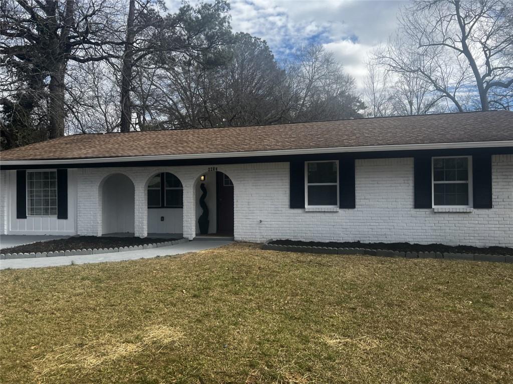 2204 Emerald Castle Drive Decatur, GA 30035 - Photo 1 of 1 a house with trees in front of it