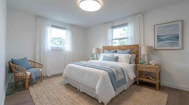 a bedroom with a bed and window