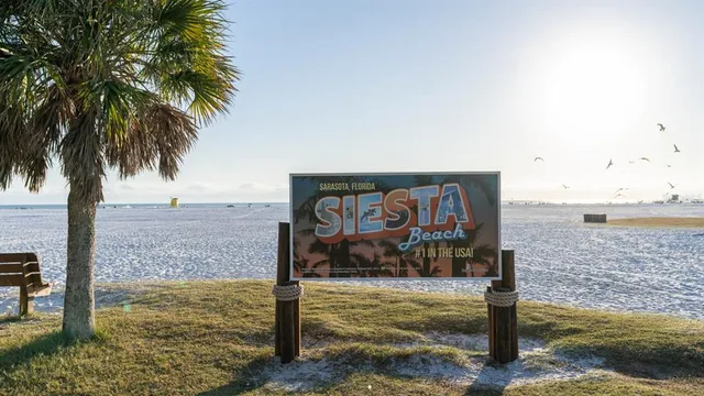 an empty room with a window and wooden floor