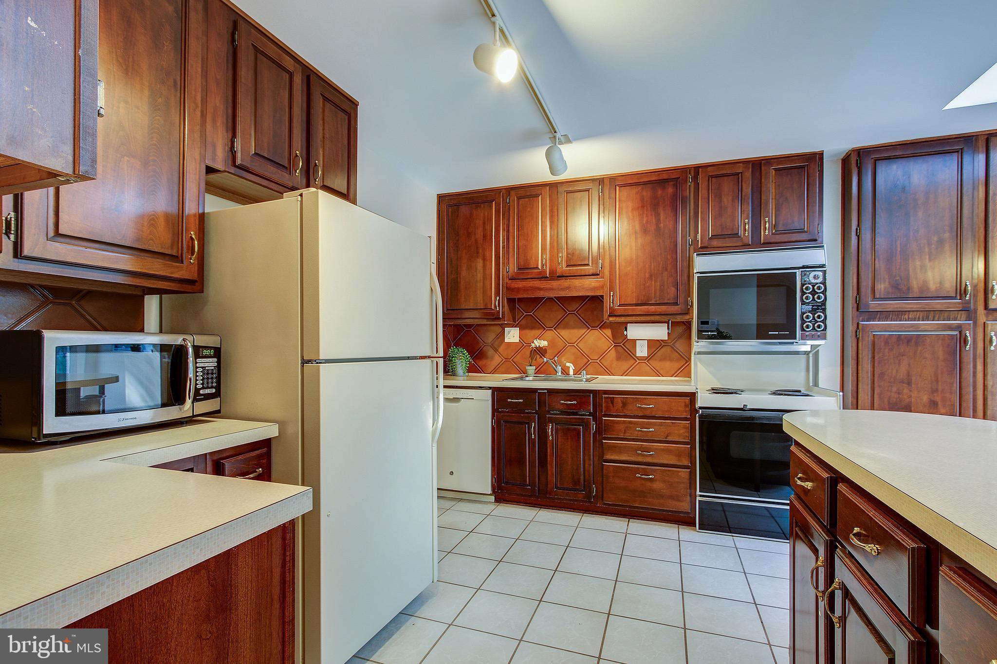 12713 Barbara Road Wheaton, MD 20906 - Photo 11 of 32 Spacious Kitchen with Loads of Wood Cabinetry.
