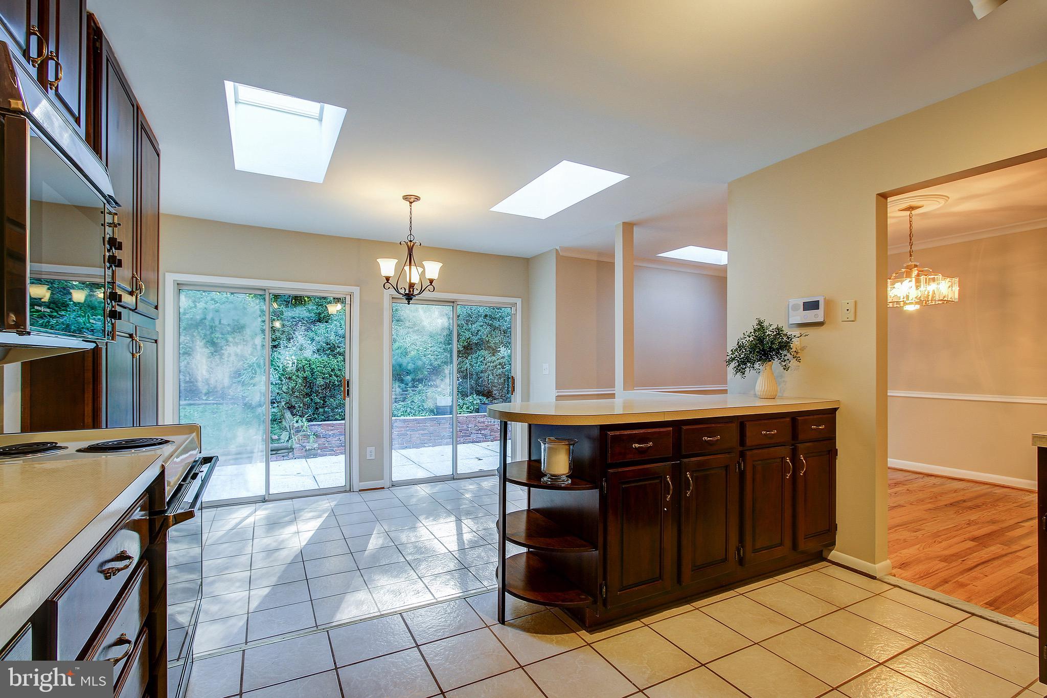 12713 Barbara Road Wheaton, MD 20906 - Photo 12 of 32 Streaming Sunlight Beams In Through Skylights.