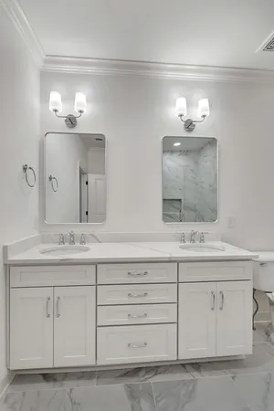 a bathroom with a sink vanity and mirror
