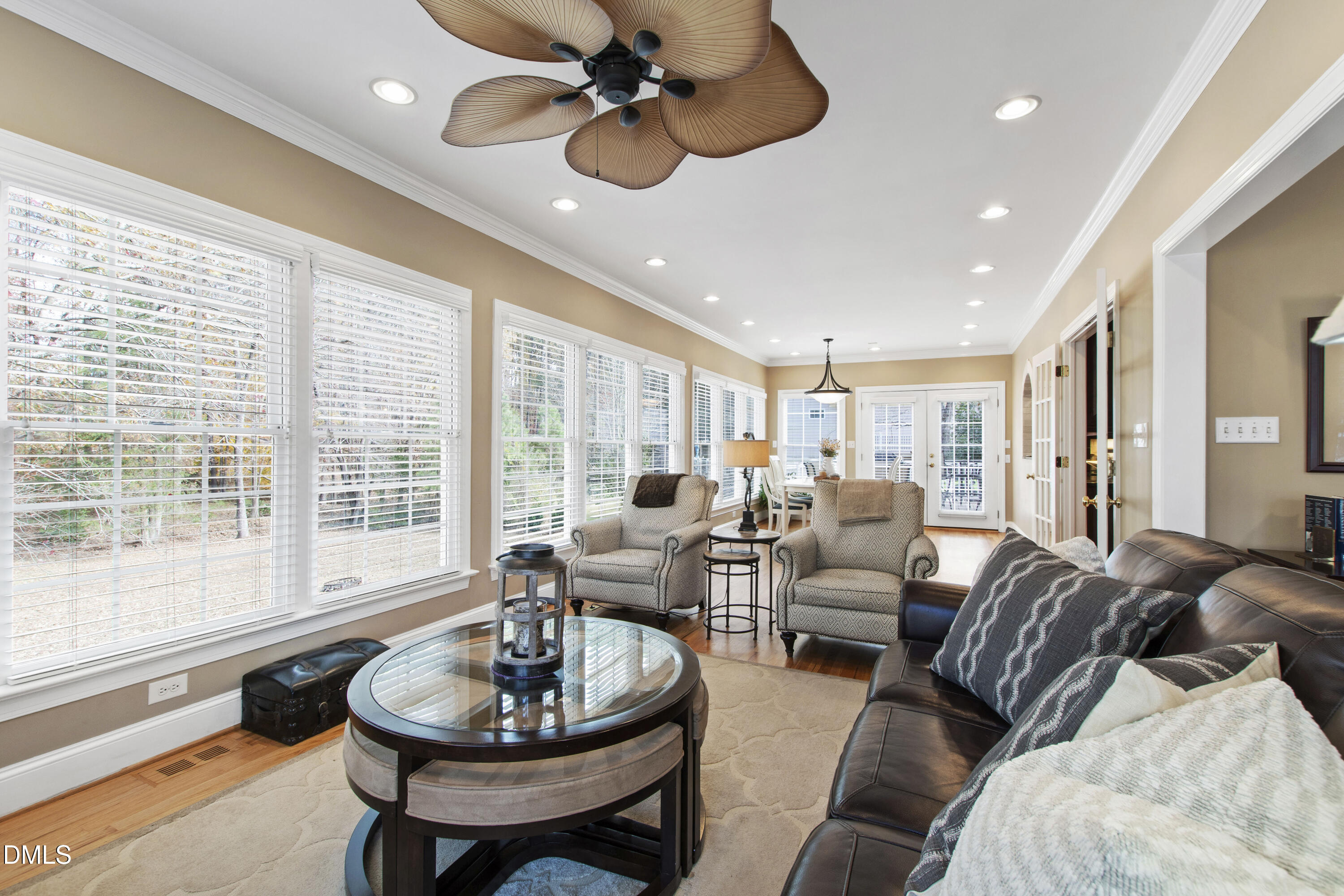 2405 Welsh Tavern Way Wake Forest, NC 27587 - Photo 11 of 58 a living room with furniture a ceiling fan and a large window