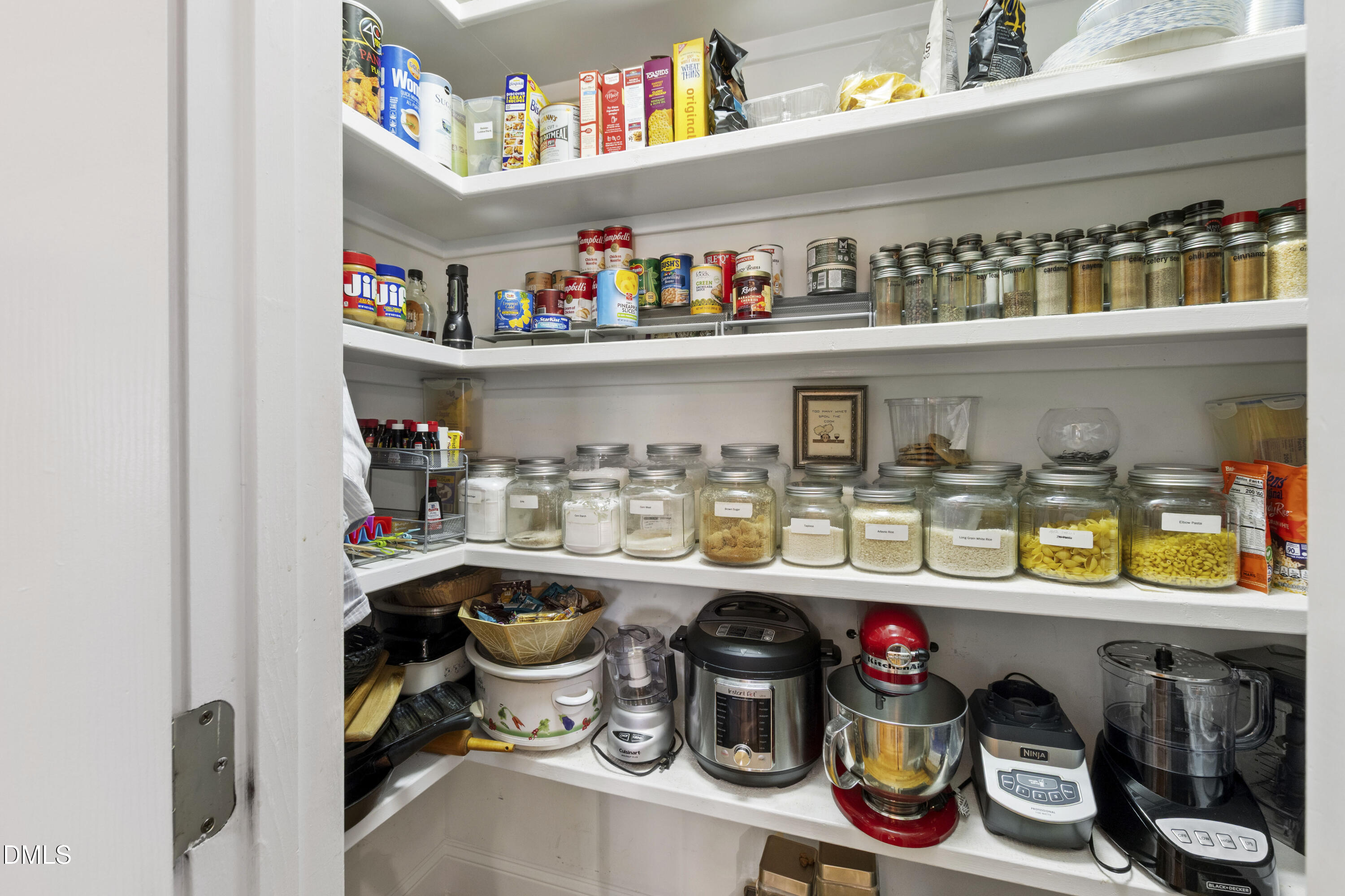2405 Welsh Tavern Way Wake Forest, NC 27587 - Photo 15 of 58 a room with lots of clutter and cabinets