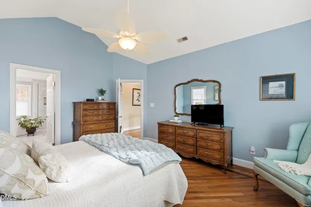 a bedroom with a bed and a tv