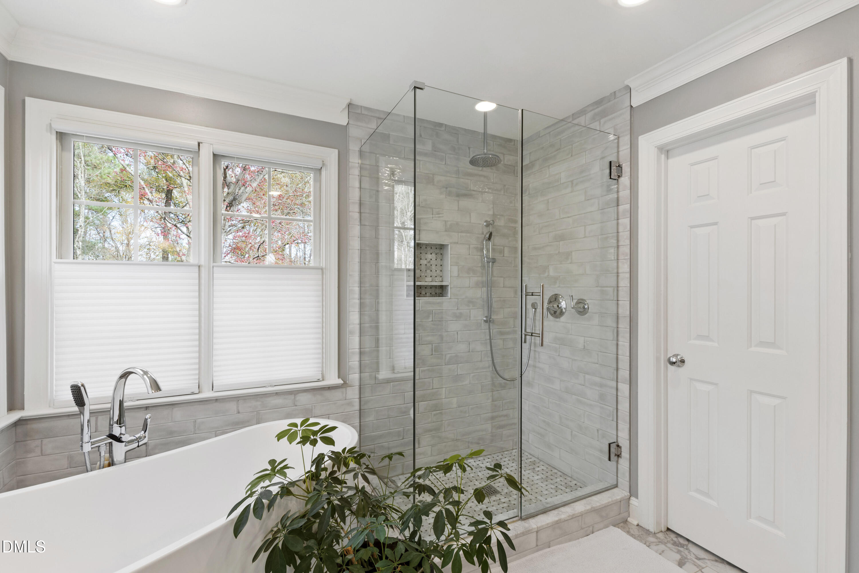 2405 Welsh Tavern Way Wake Forest, NC 27587 - Photo 34 of 58 a bathroom with a shower sink and mirror