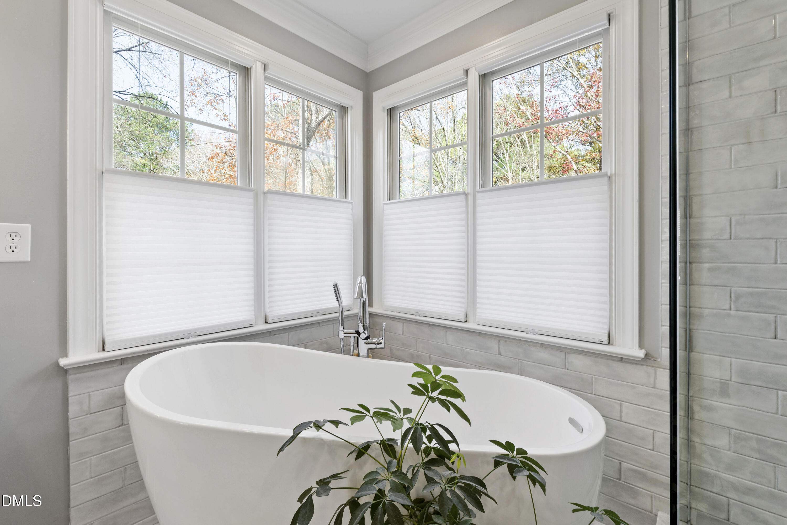 2405 Welsh Tavern Way Wake Forest, NC 27587 - Photo 35 of 58 a white bath tub sitting in a bathroom next to a window
