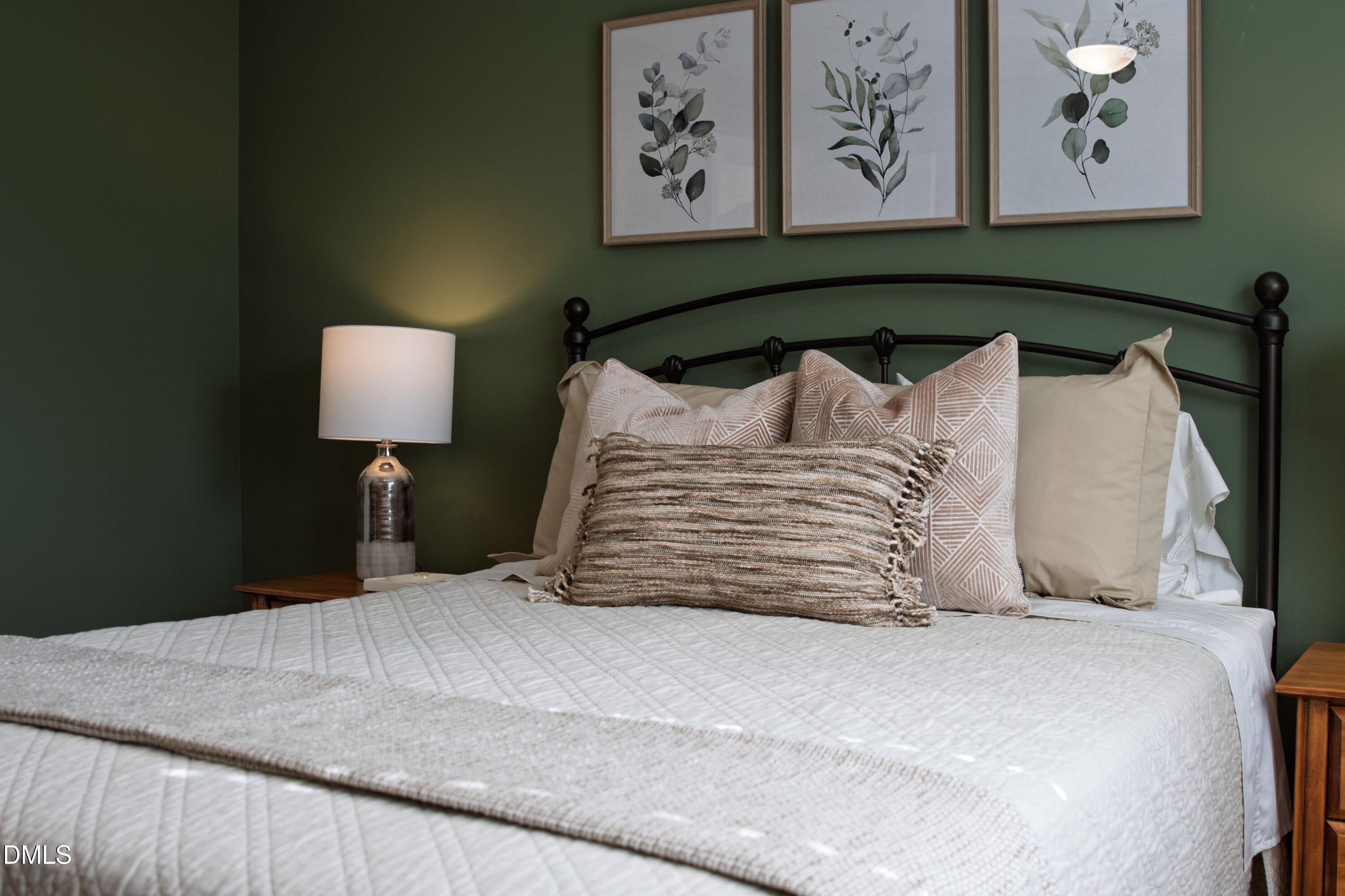 2405 Welsh Tavern Way Wake Forest, NC 27587 - Photo 38 of 58 a bedroom with a bed and a painting on the wall