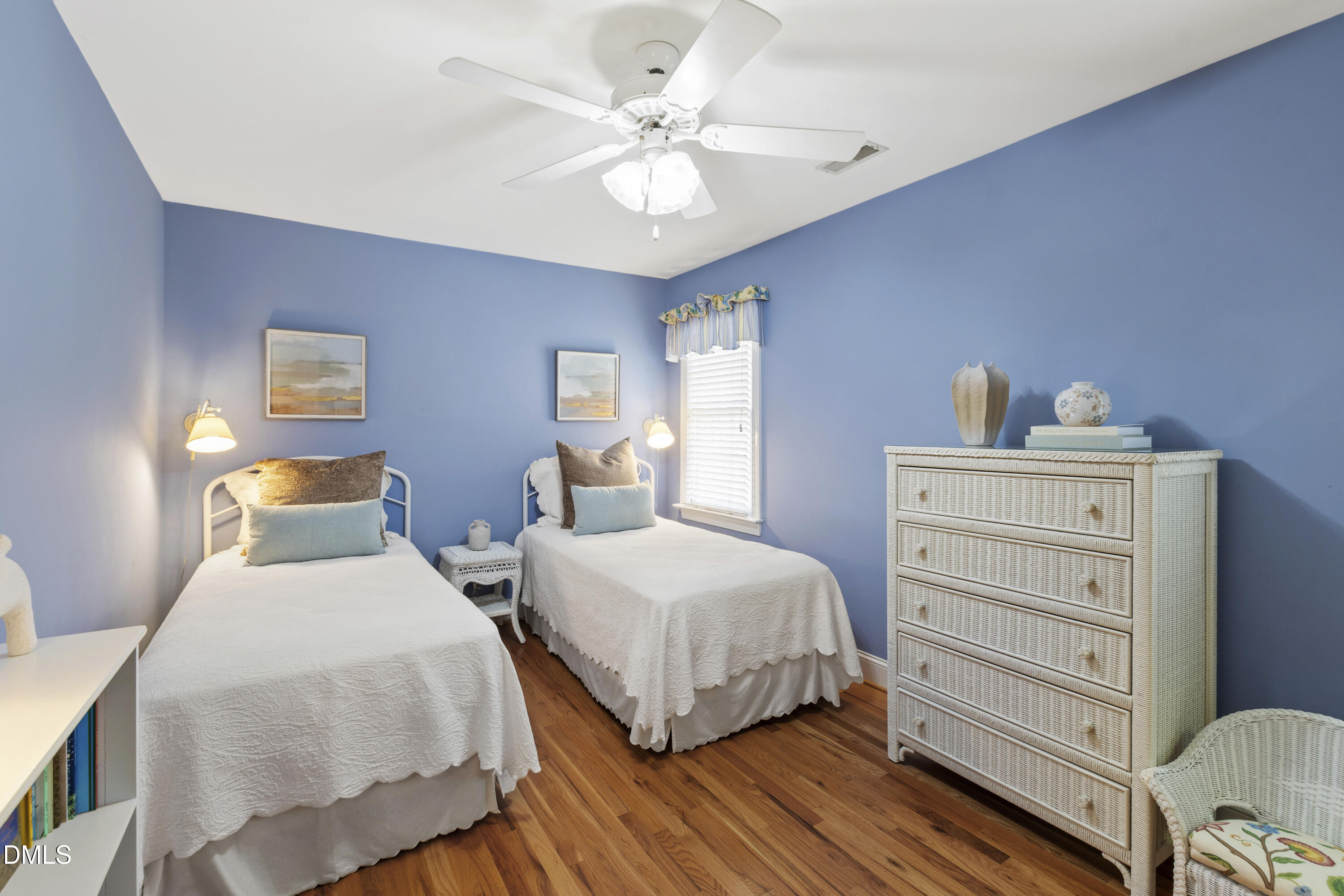 2405 Welsh Tavern Way Wake Forest, NC 27587 - Photo 40 of 58 a bedroom with two beds and a chandelier