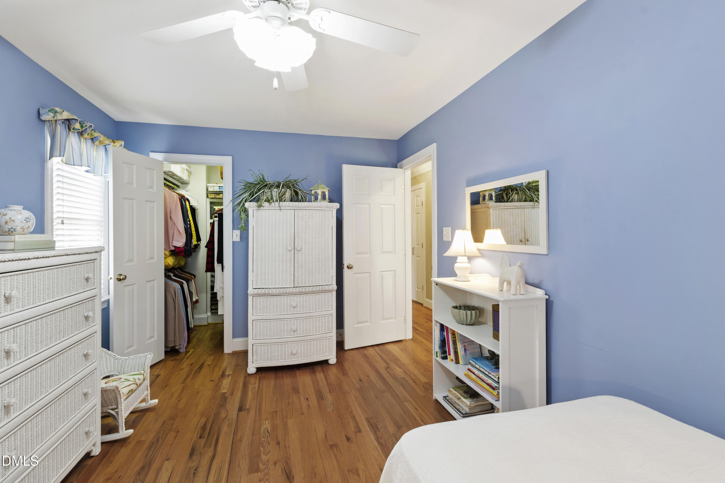 2405 Welsh Tavern Way Wake Forest, NC 27587 - Photo 41 of 58 a bedroom with a bed and a flat tv screen on the dresser