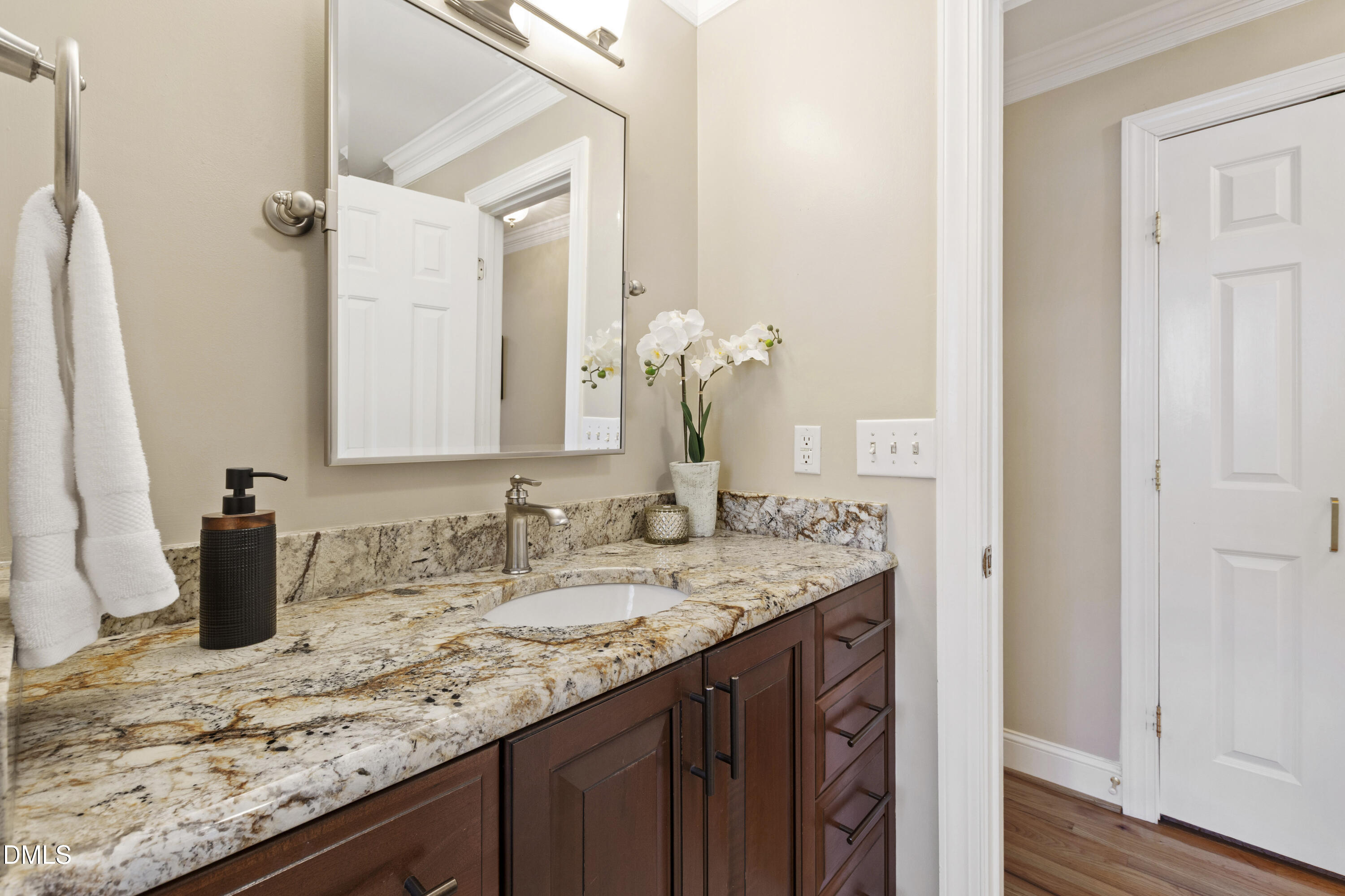 2405 Welsh Tavern Way Wake Forest, NC 27587 - Photo 43 of 58 a bathroom with a granite countertop sink and a mirror