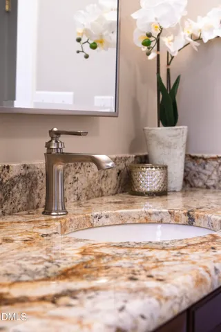 a view of a balcony with wooden floor and outdoor seating