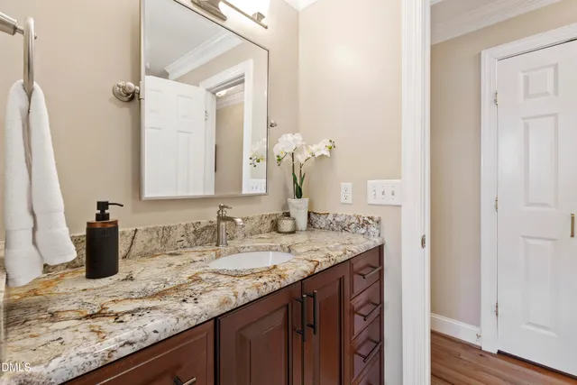 a view of a house with patio and wooden floor