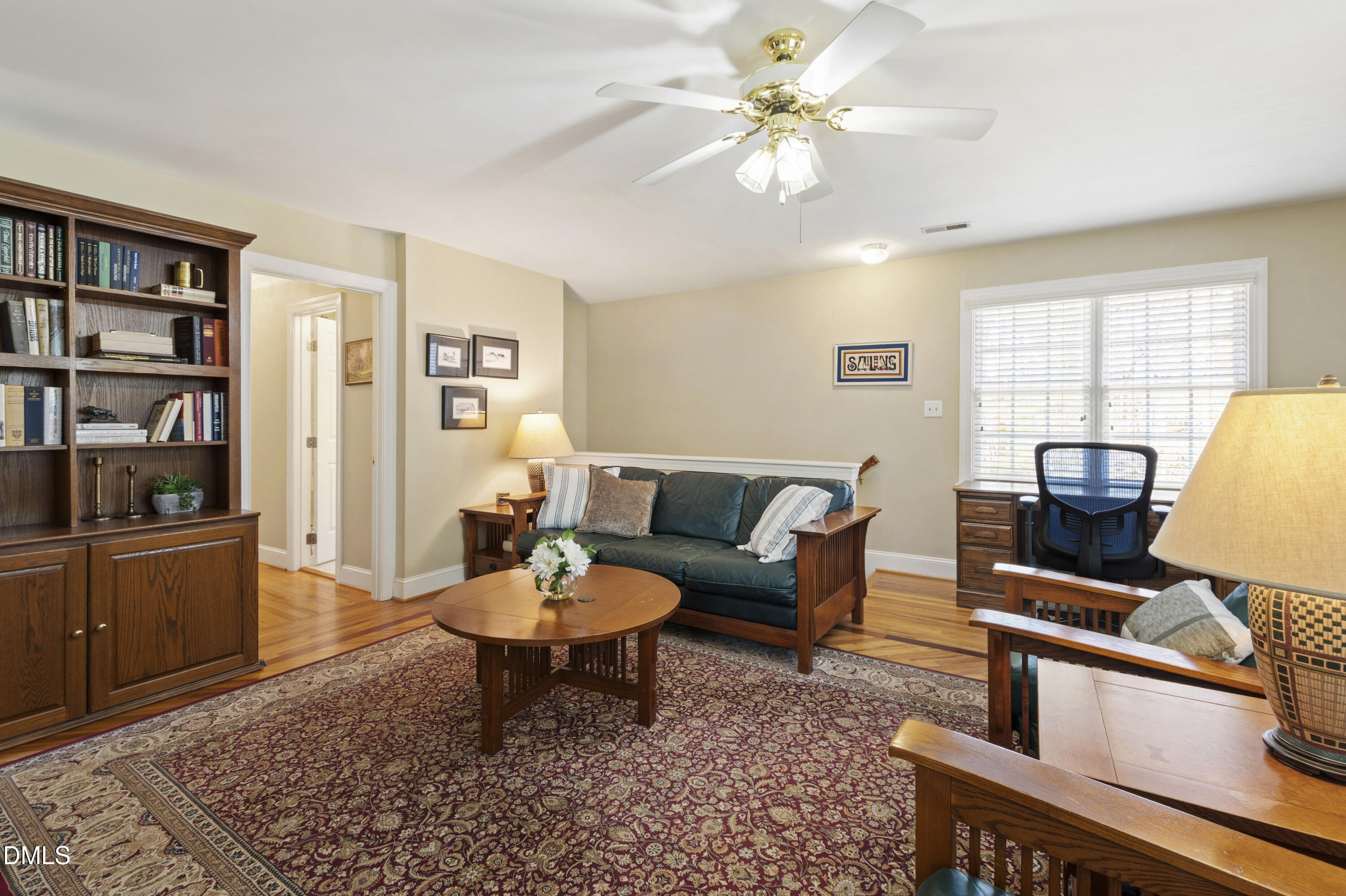 2405 Welsh Tavern Way Wake Forest, NC 27587 - Photo 47 of 58 a living room with furniture a rug and a window