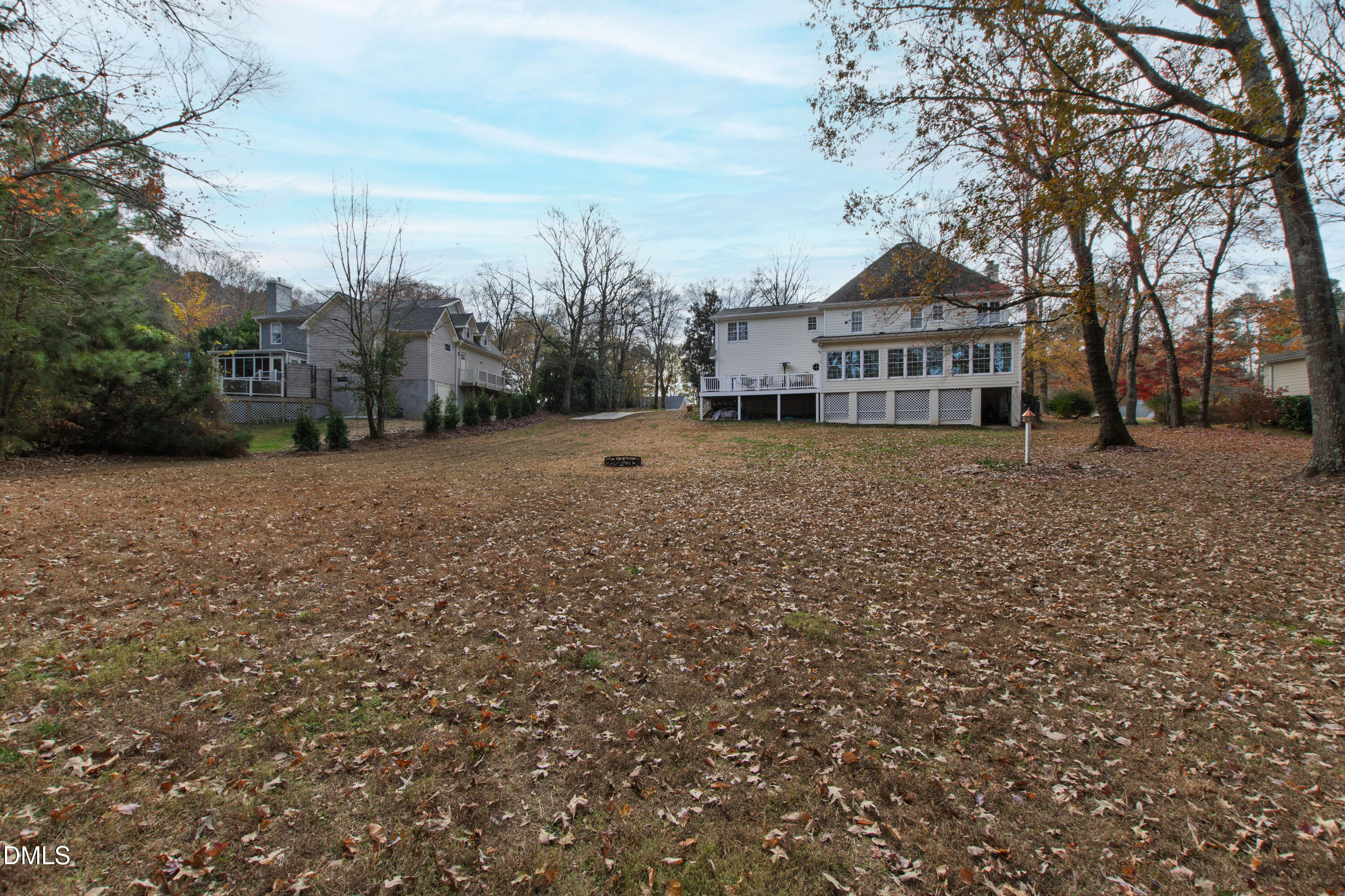 2405 Welsh Tavern Way Wake Forest, NC 27587 - Photo 54 of 58 a view of a large house with a big yard and large trees