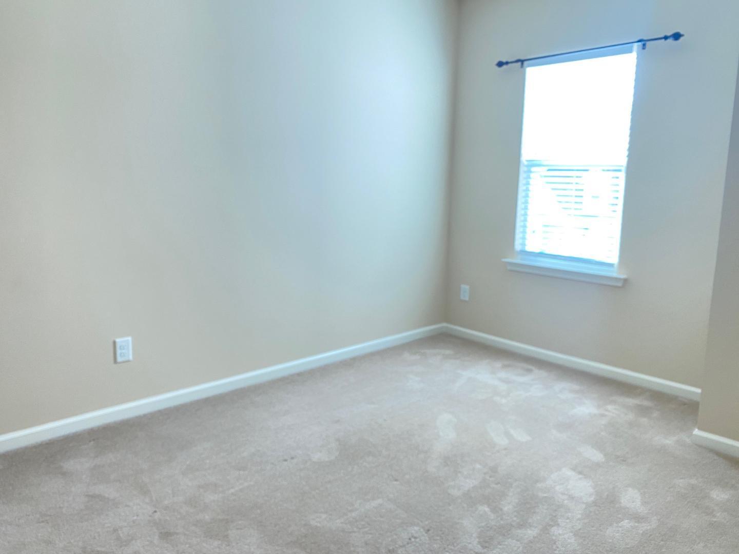 126 Zante Currant Road Durham, NC 27703 - Photo 13 of 23 an empty room with a window