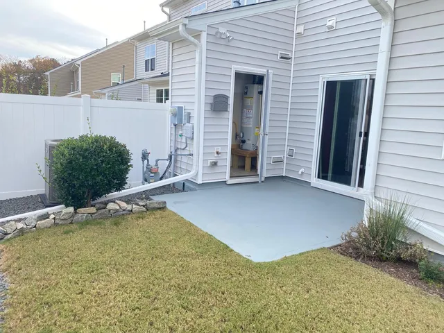 a view of an house with backyard space and garden