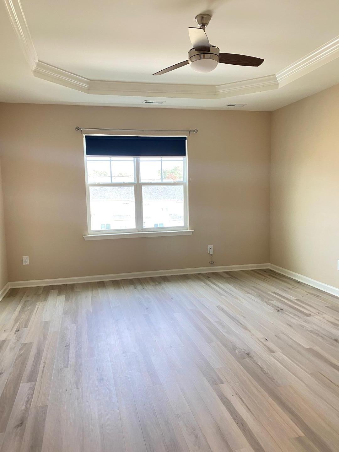 126 Zante Currant Road Durham, NC 27703 - Photo 8 of 23 wooden floor in an empty room with a window