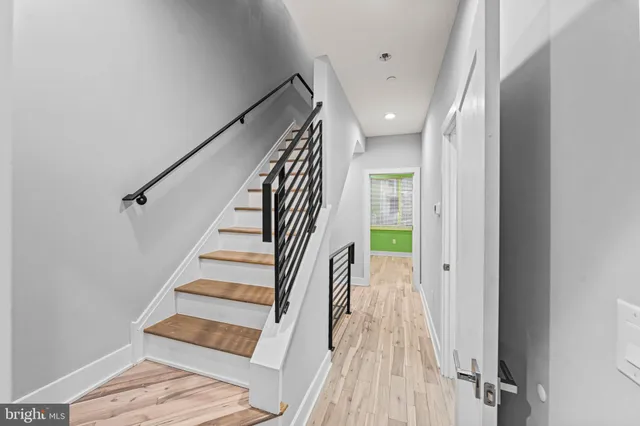 a kitchen with kitchen island a sink appliances and cabinets