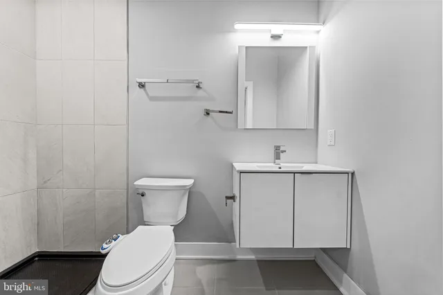 a view of entryway with wooden floor and stairs