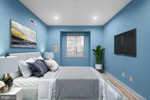 a white toilet sitting next to a bathroom sink