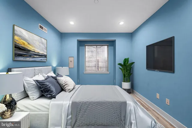 a white toilet sitting next to a bathroom sink