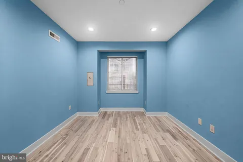 a bedroom with a bed and a potted plant