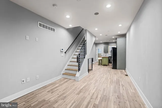 a view of entryway with wooden floor