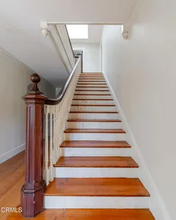 a living room with a fireplace and a large window