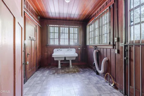 a front view of a house with trees