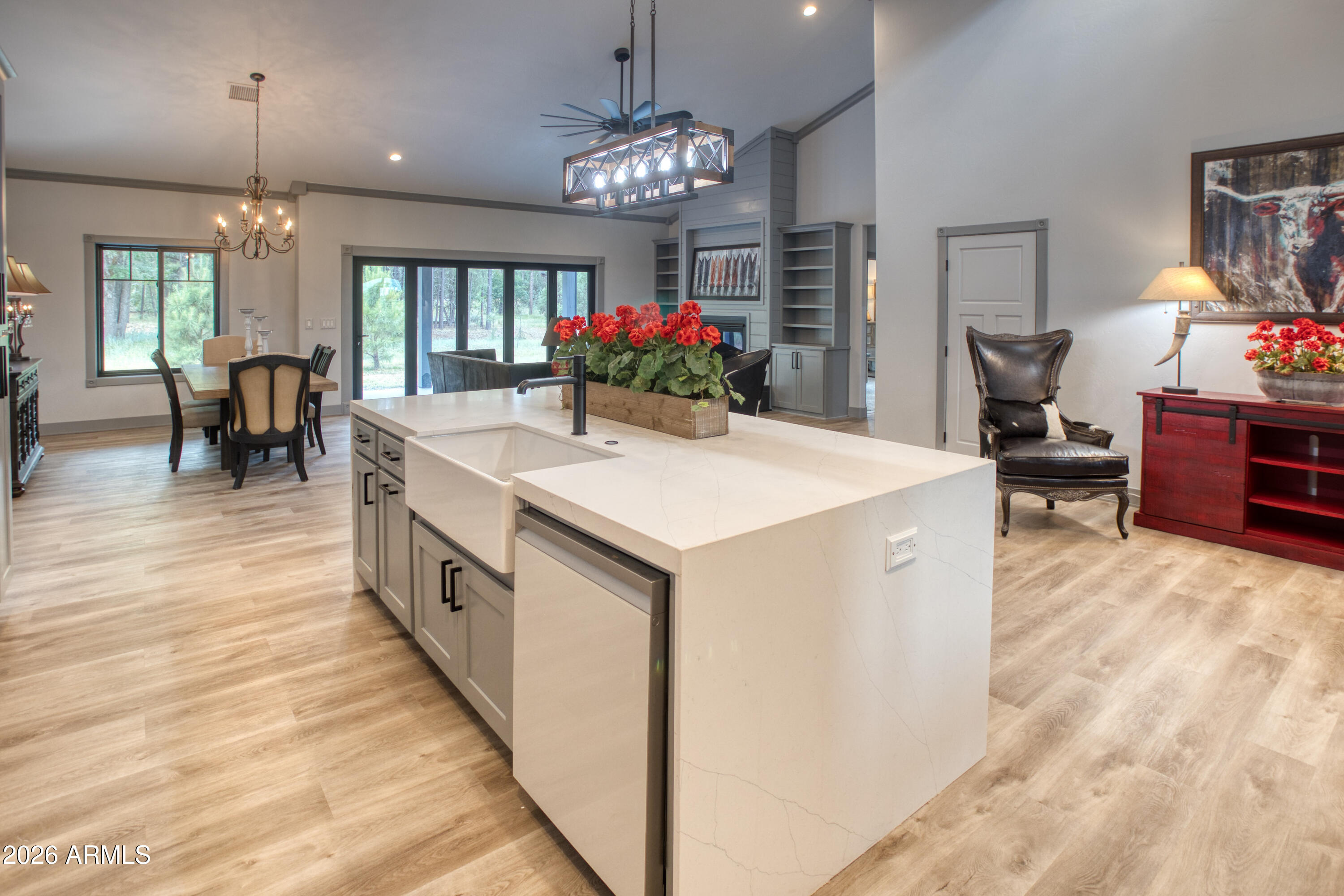 2281 West Edgewater Show Low, AZ 85901 - Photo 3 of 46 a large kitchen with kitchen island a chandelier and living room view