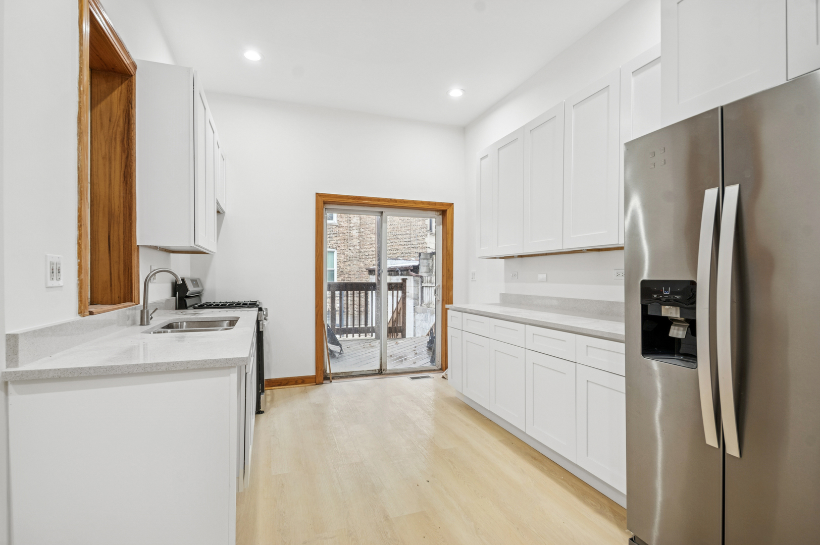 2336 West Taylor Street Chicago, IL 60612 - Photo 6 of 29 a kitchen with a refrigerator sink and cabinets