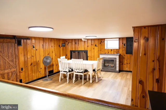 a view of kitchen with furniture and wooden floor