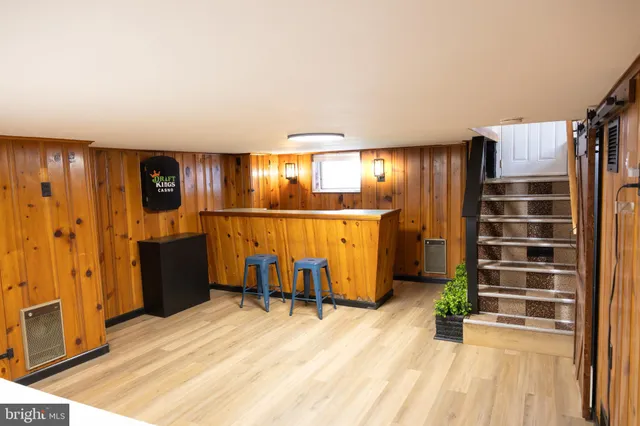 a view of a room with wooden floor and chair