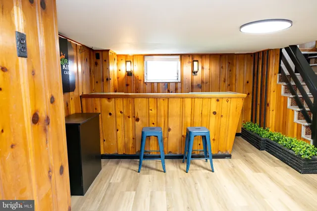 a bathroom with a sink a toilet and shower curtain