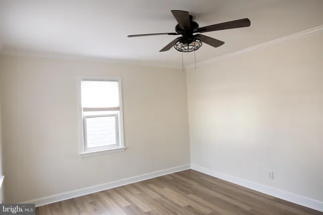 a view of a livingroom with a fireplace and wooden floor