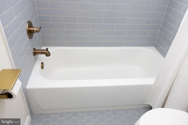a bathroom with a sink vanity and a mirror