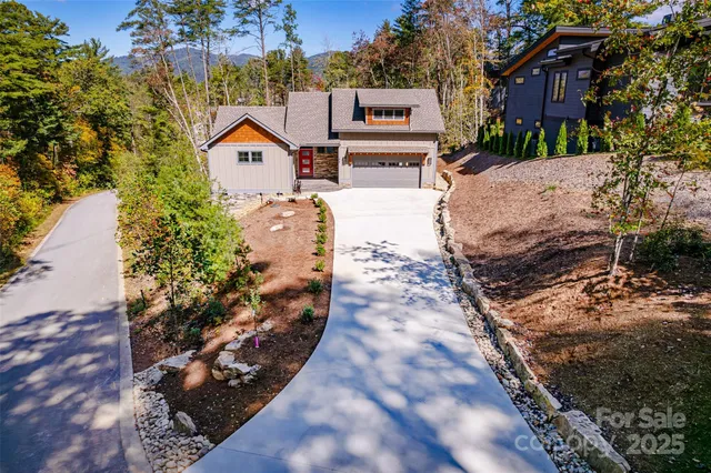 a aerial view of a house with a yard