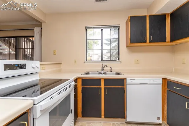 a bathroom with a sink shower and a mirror