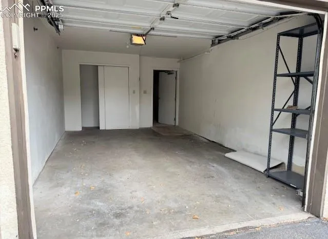 a living room with furniture and a mirror