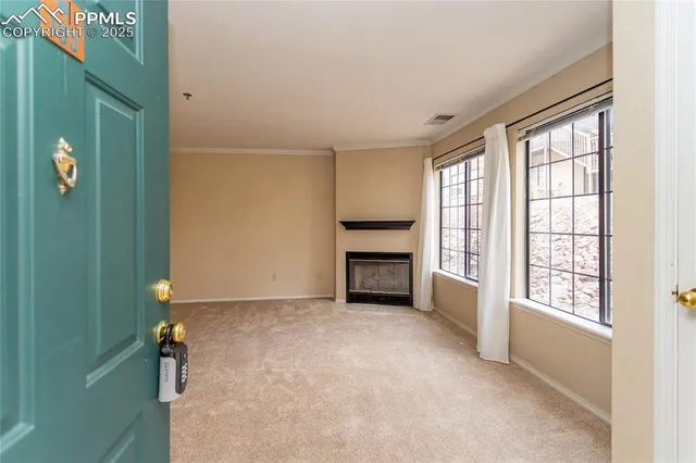 a view of an empty room with a window