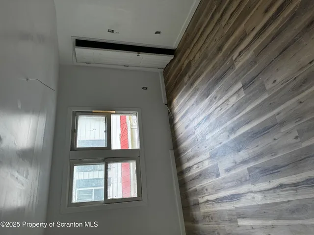 a living room with furniture and a lamp