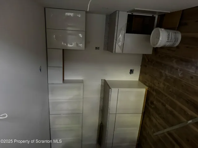 a view of an empty room with windows