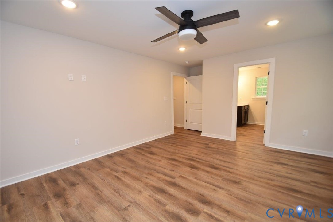 1749 Hollands Road Palmyra, VA 22963 - Photo 24 of 40 Unfurnished bedroom with ensuite bathroom, wood fi