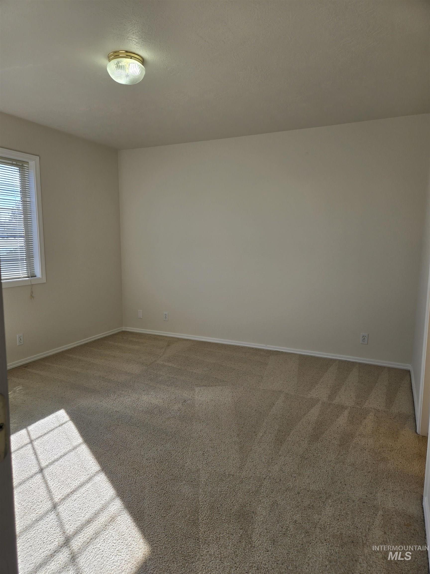 183 Southwest 18th Street Ontario, OR 97914 - Photo 22 of 32 Empty room with light carpet and baseboards